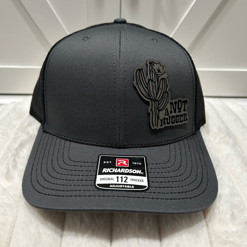 Not a hugger Laser engraved Richardson trucker hat.